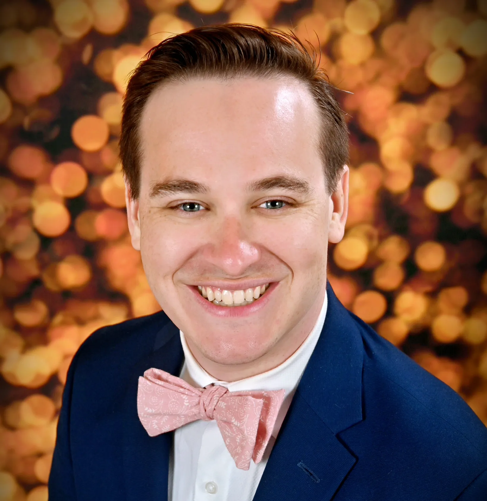 headshot of devan beitel in blue suit